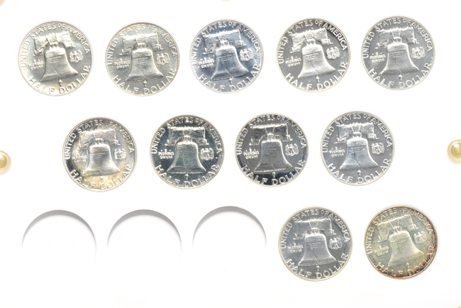 Collections of silver Proof Roosevelt dimes, Washington quarters, and Franklin half-dollars in three Capital Plastics holders