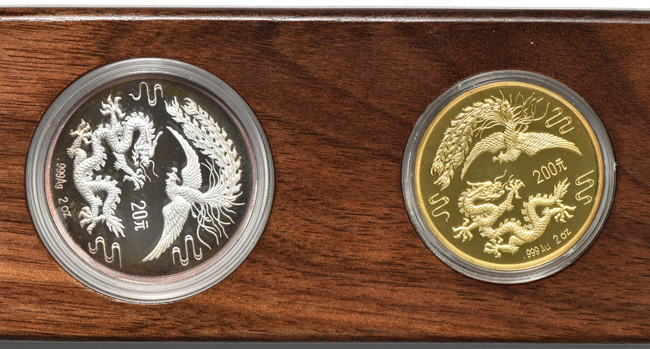 China - 1990 2oz gold and 2oz silver Dragon and Phoenix set with certificates, stand, wooden box, and outer sleeve
