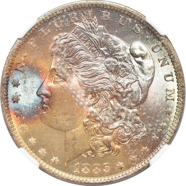 Four toned silver dollars certified MS-65 by NGC