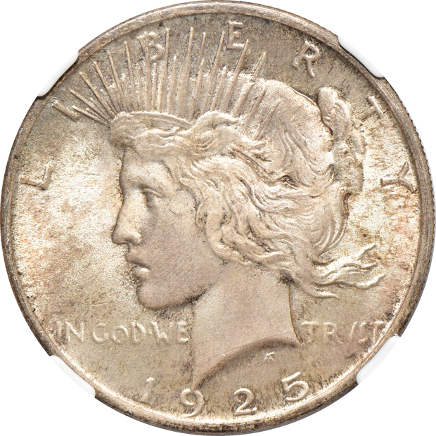 Four toned silver dollars certified MS-65 by NGC
