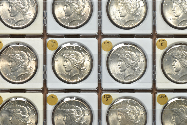 Twenty-two Peace silver dollars