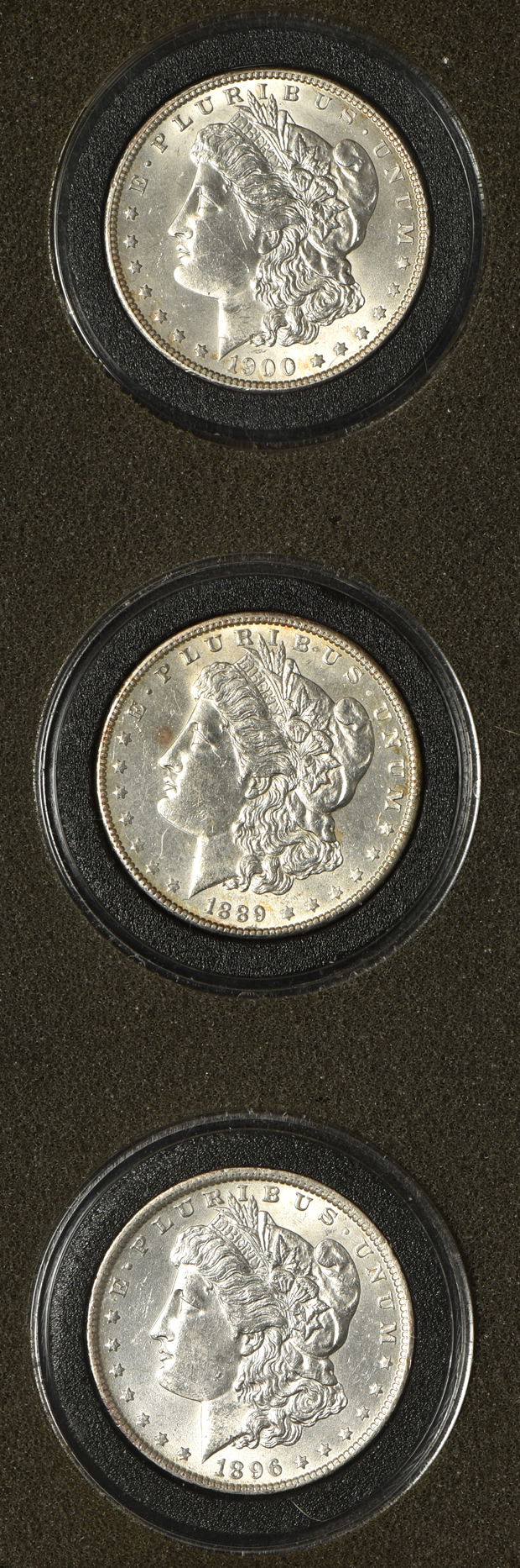 Fifteen Morgan silver dollars in a wood box