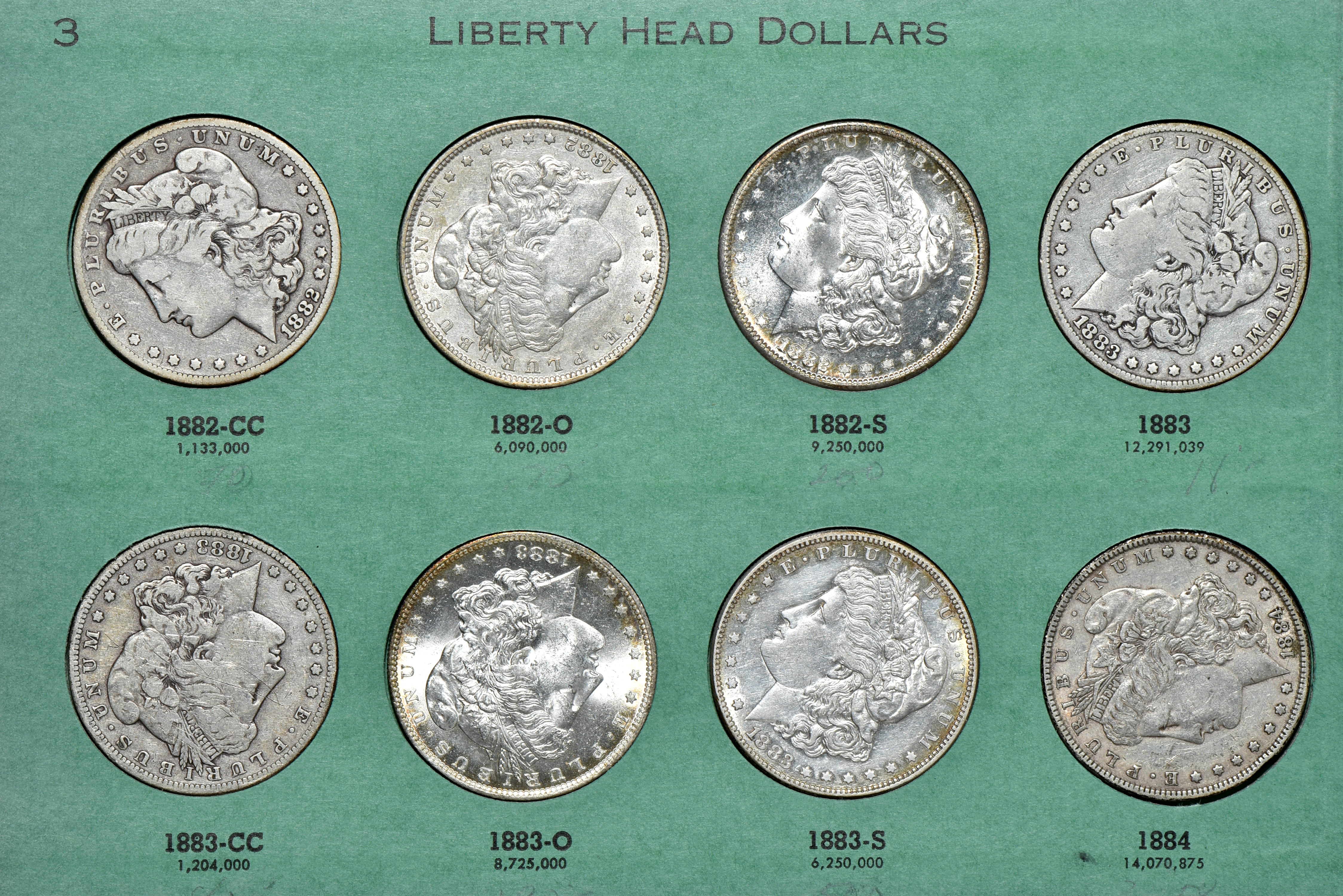 Collection of 31 different Morgan silver dollars in a Meghrig album