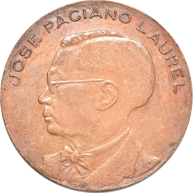 Two bronze medals, a one peso, and a 50 centavos