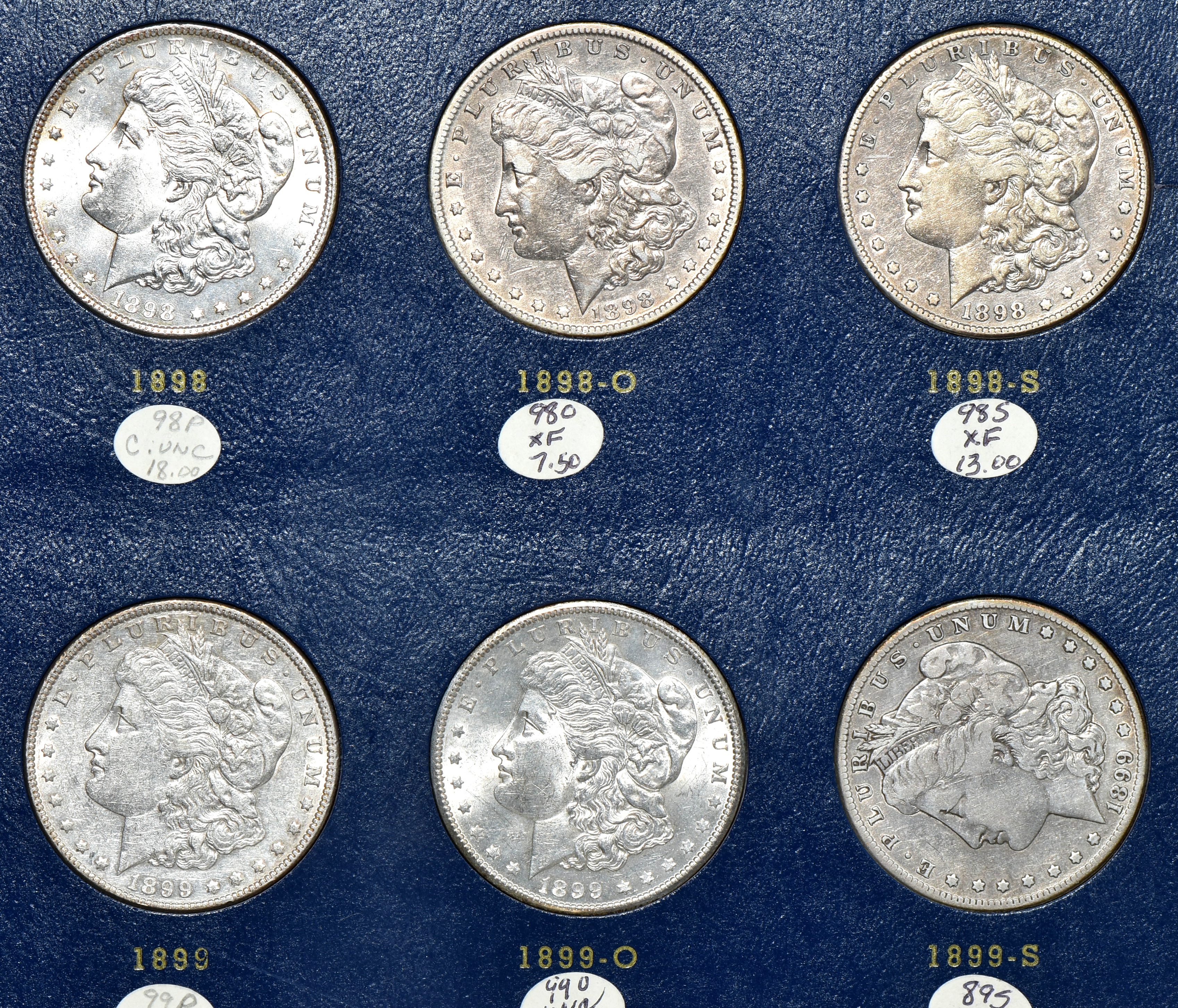 Collection of Morgan silver dollars 1897 through 1921-S in a Whitman 9429 album