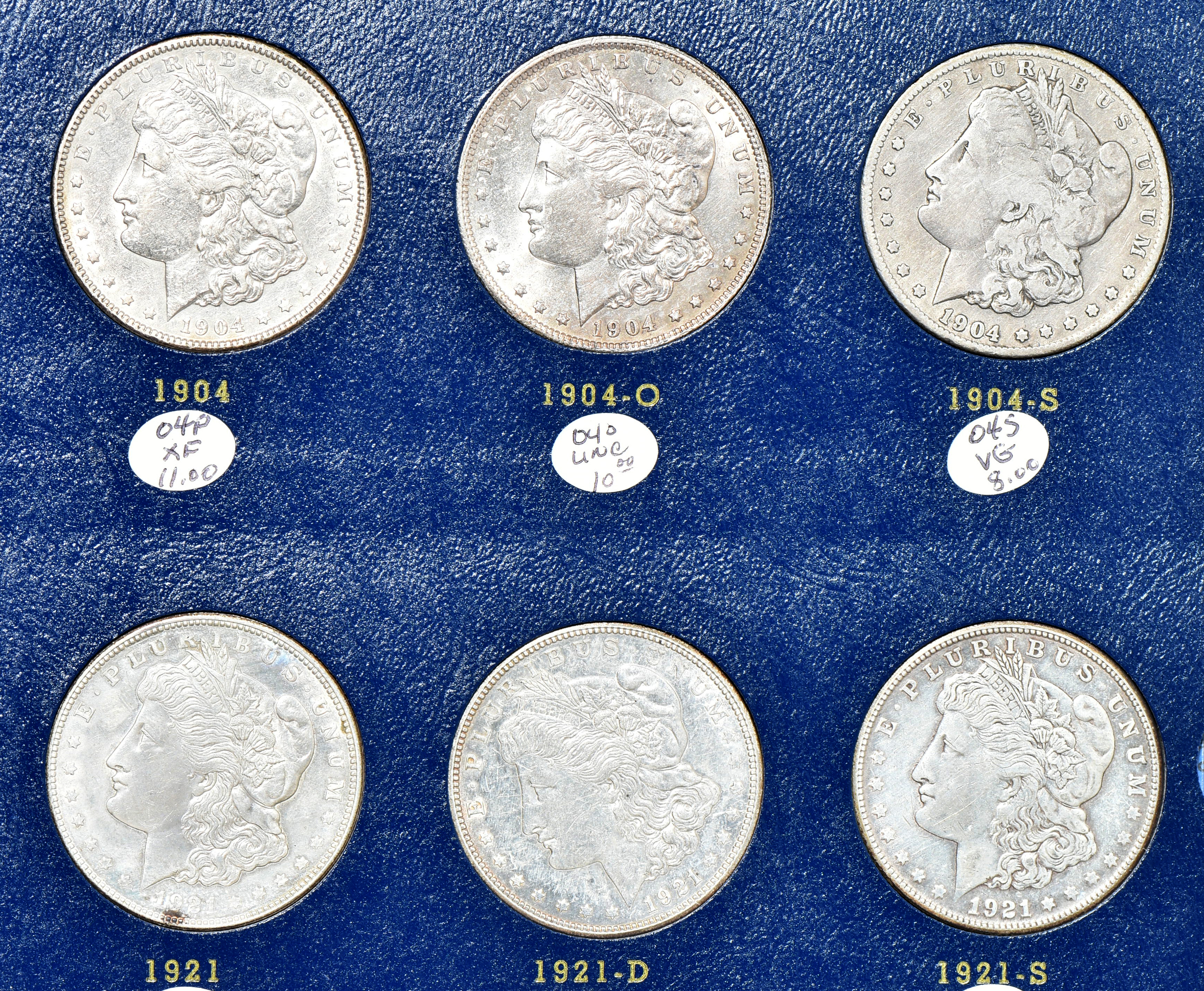 Collection of Morgan silver dollars 1897 through 1921-S in a Whitman 9429 album