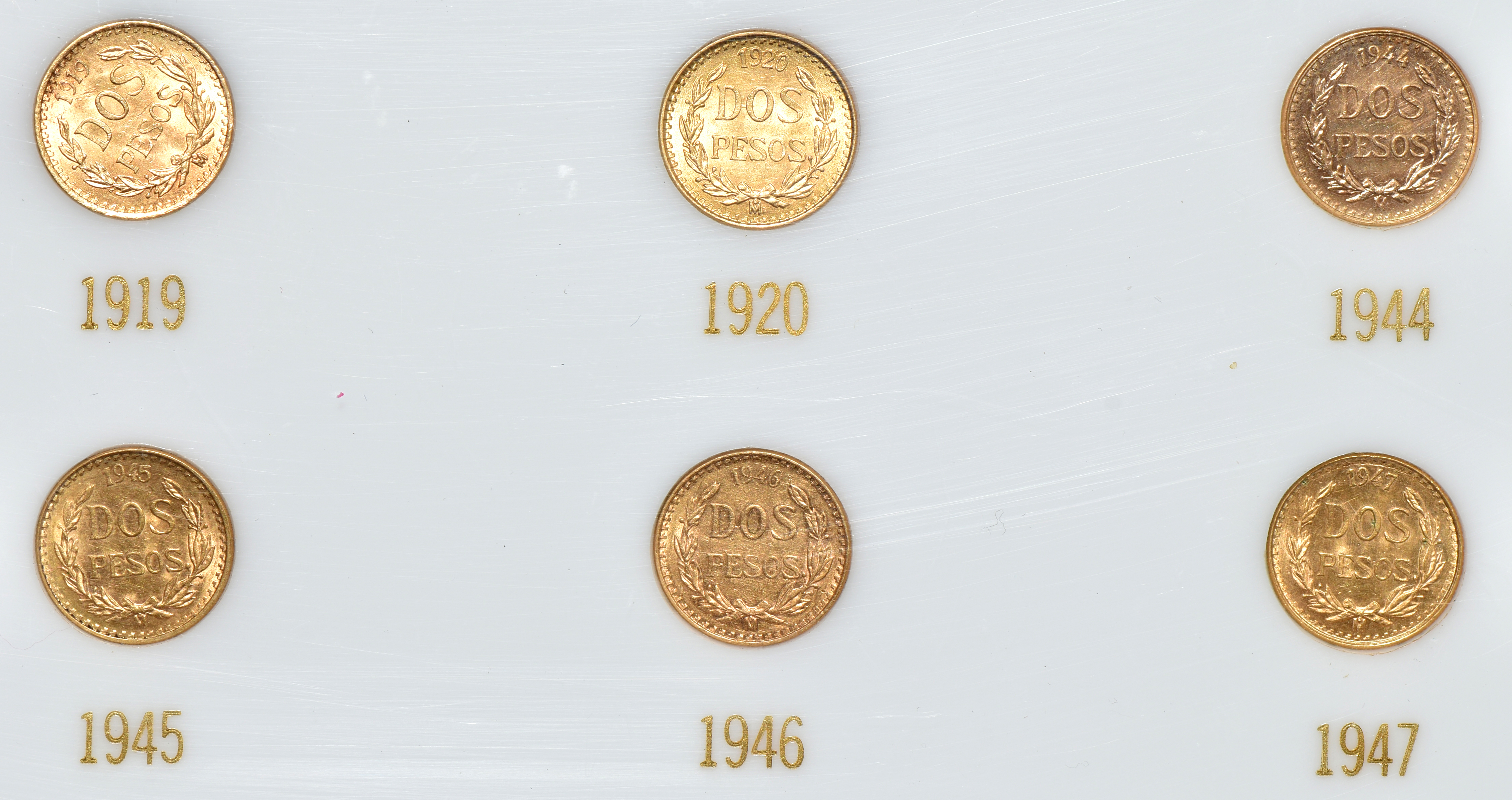 Mexico - Gold 2 pesos set in a Capital Plastics holder