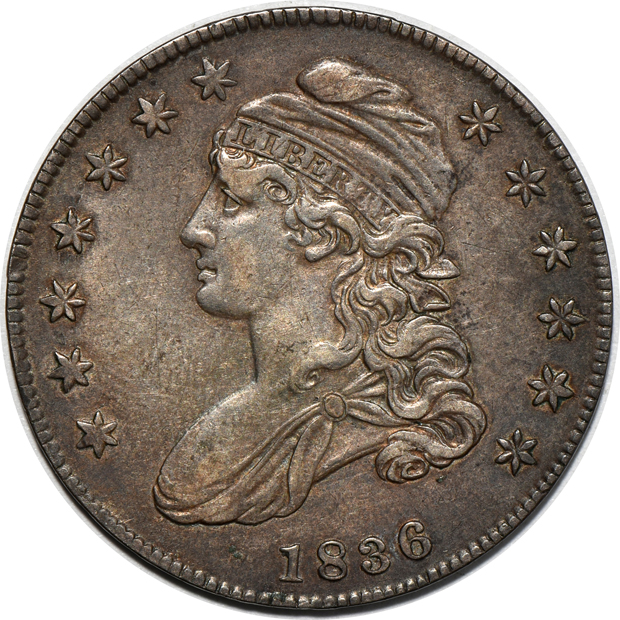 Four capped-bust half dollars, all XF