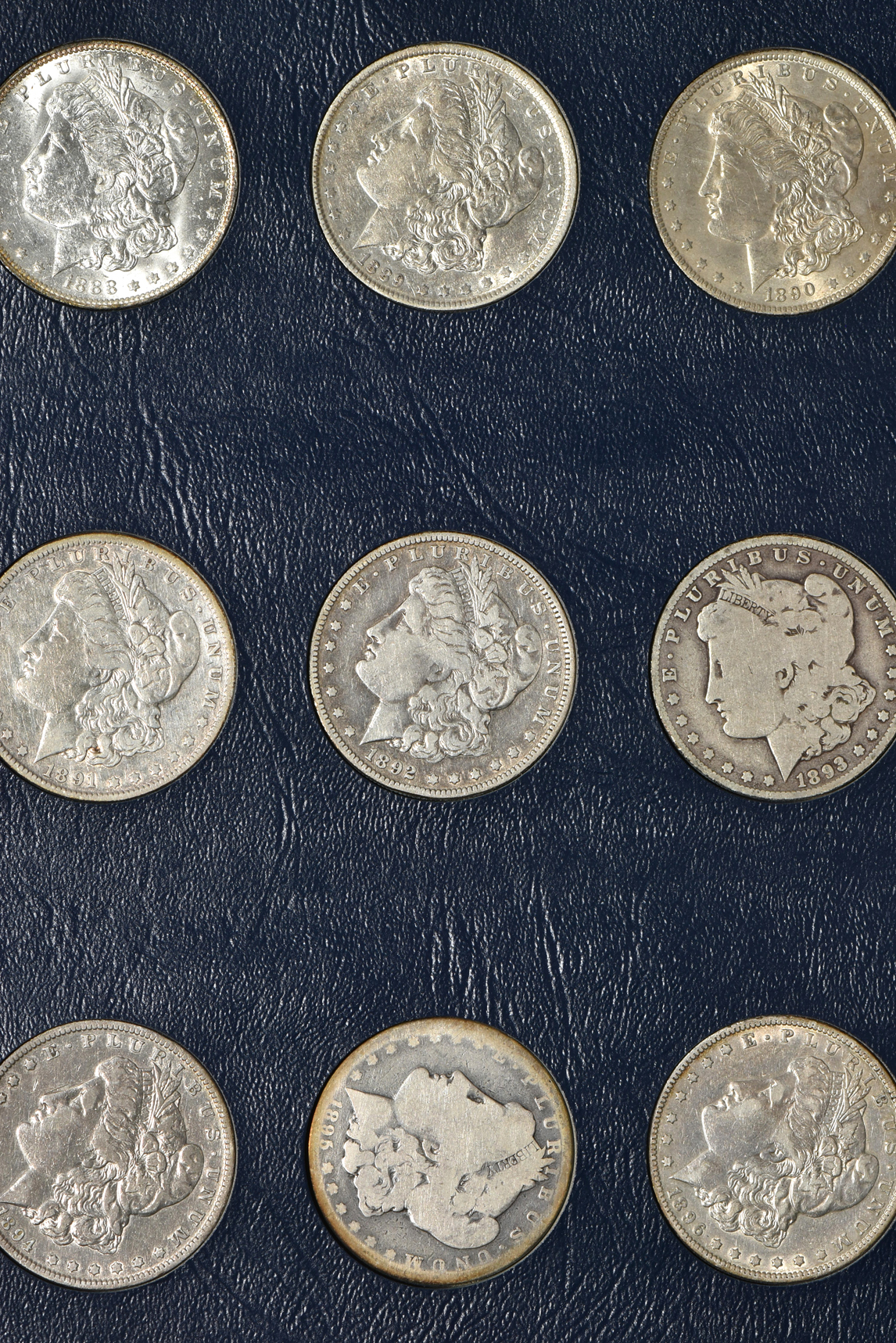 Collection of Morgan silver dollars in a Whitman 9137 album