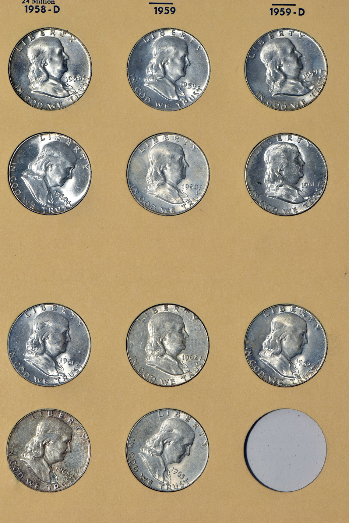 Complete collection of Washington quarters 1932 through 1974-D, and a complete collection of Franklin half-dollars, both in Library of Coins albums