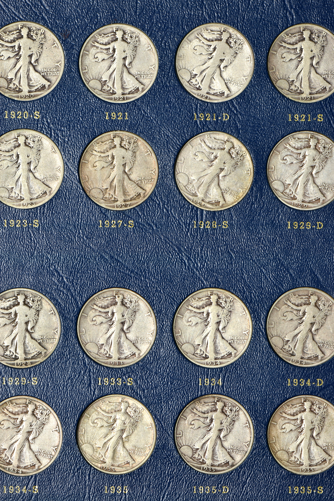Complete collection of Walking Liberty half-dollars in two Whitman albums