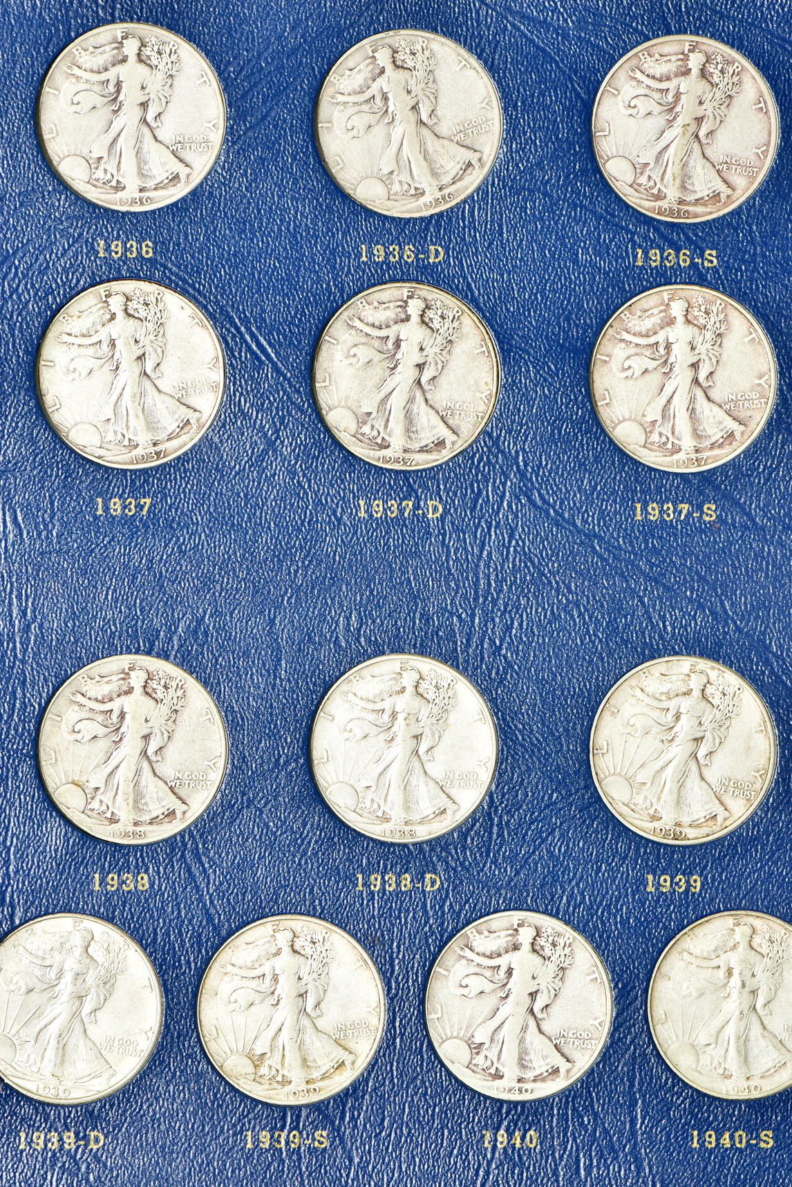 Complete collection of Walking Liberty half-dollars in two Whitman albums