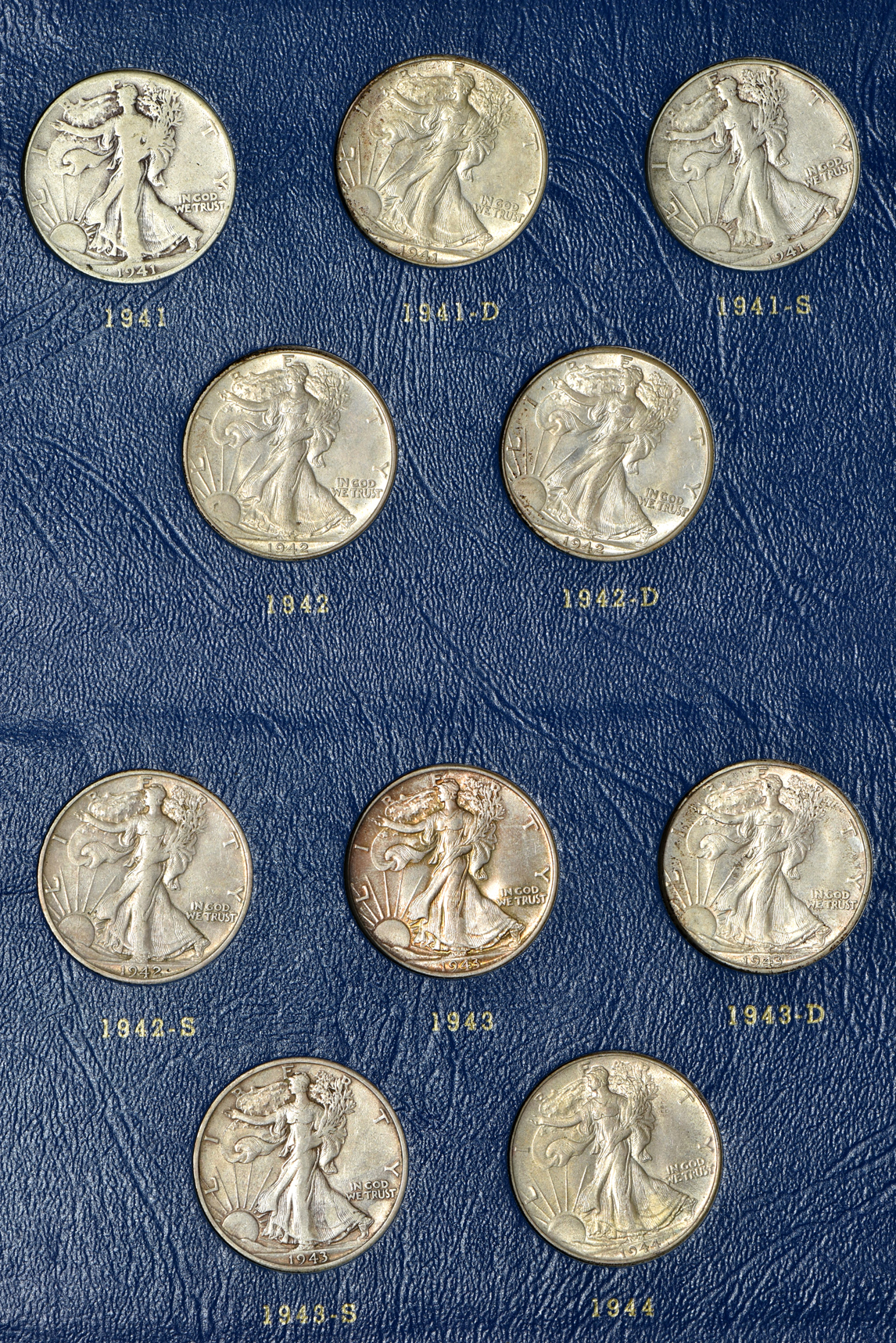 Complete collection of Walking Liberty half-dollars in two Whitman albums