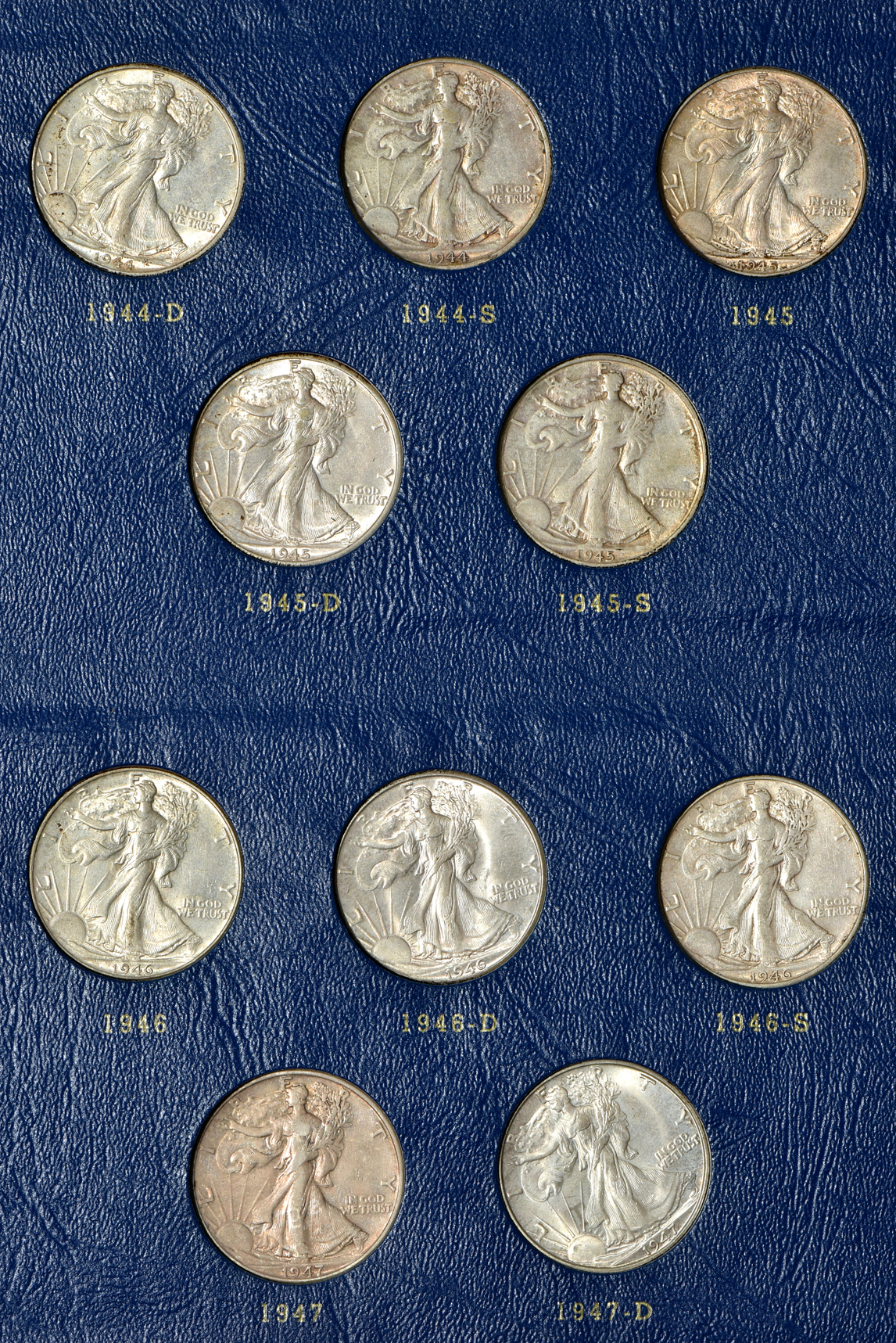 Complete collection of Walking Liberty half-dollars in two Whitman albums