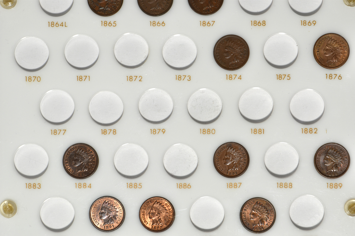 Collection of three Flying Eagle cents and 24 Indian cents in a Capital Plastics holder
