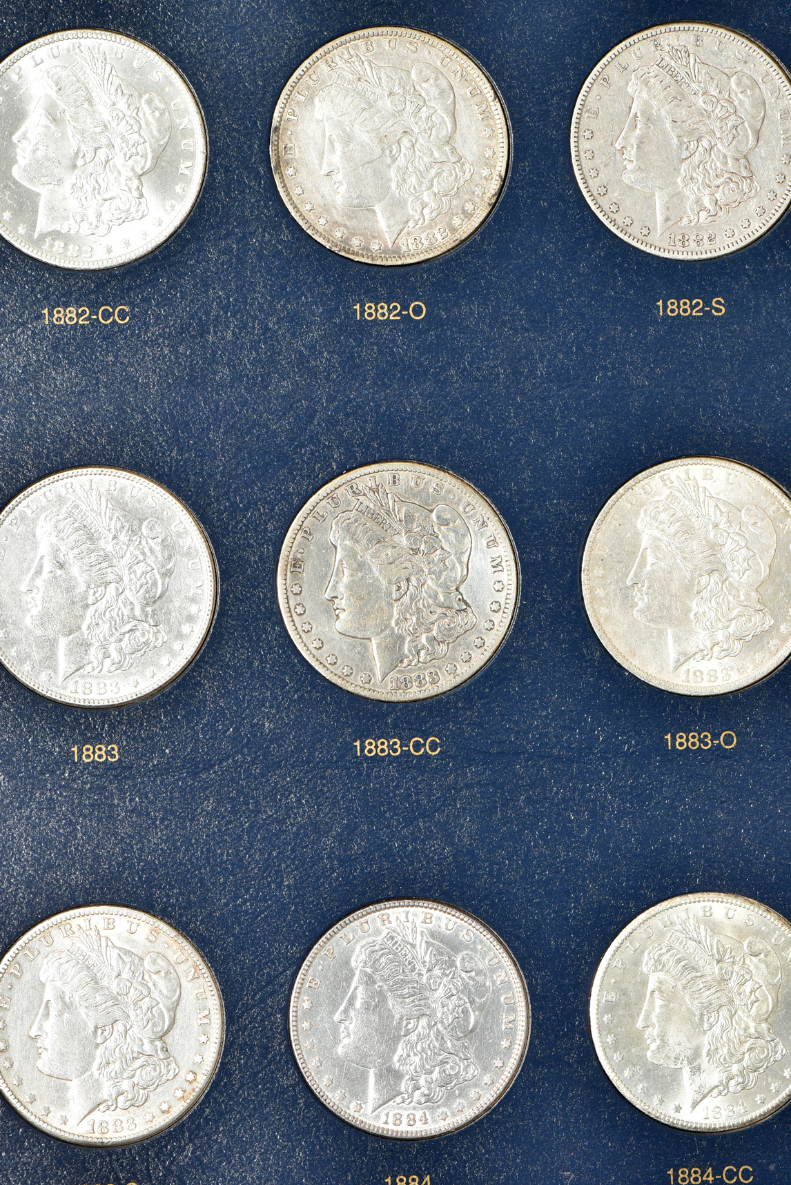 Collection of 54 different Morgan silver dollars, 1878 through 1891-S, in a Whitman classic 9128 album