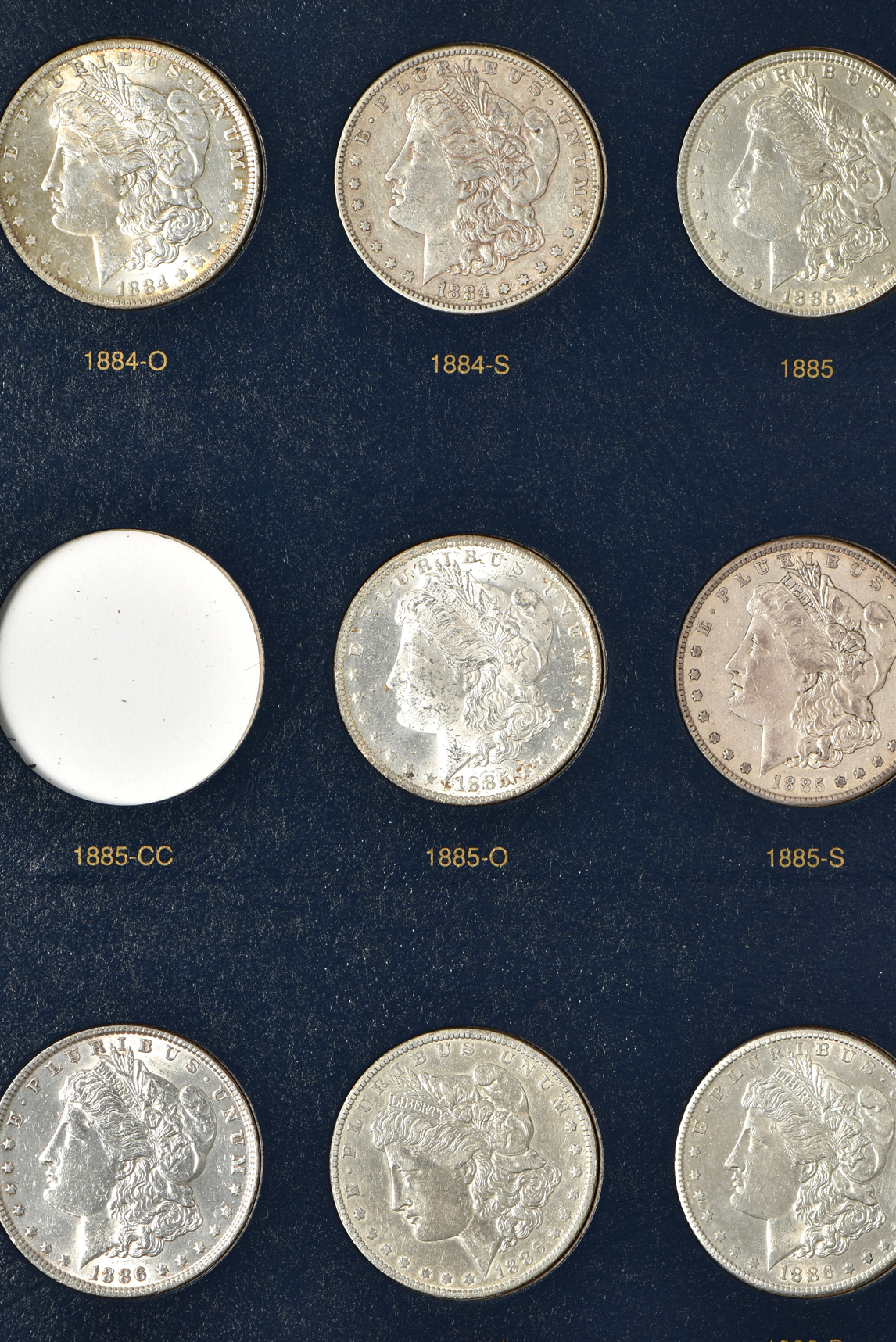 Collection of 54 different Morgan silver dollars, 1878 through 1891-S, in a Whitman classic 9128 album