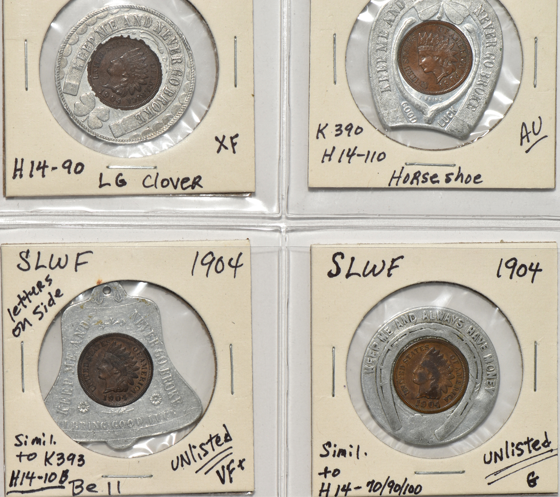 Forty 1904 World's Fair pieces in a Dansco album
