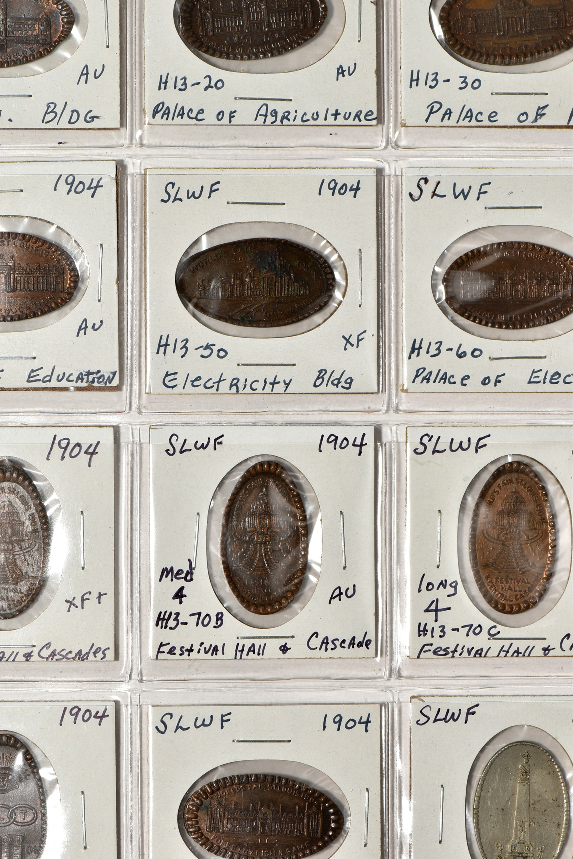 Forty 1904 World's Fair pieces in a Dansco album