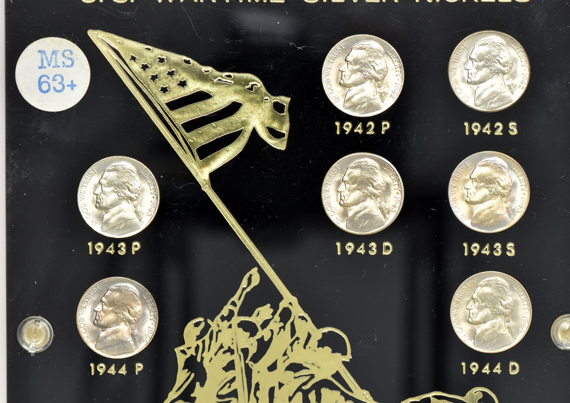 Five Uncirculated San Francisco minted Morgan silver dollars, plus two sets of Uncirculated Jefferson War nickels, all in separate Capital Plastics holders