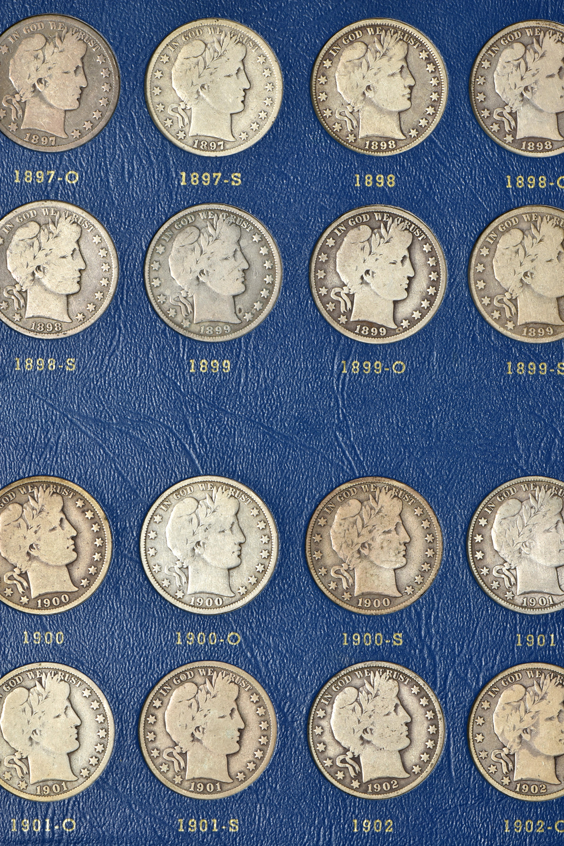 Complete collection of Barber half-dollars in two Whitman albums