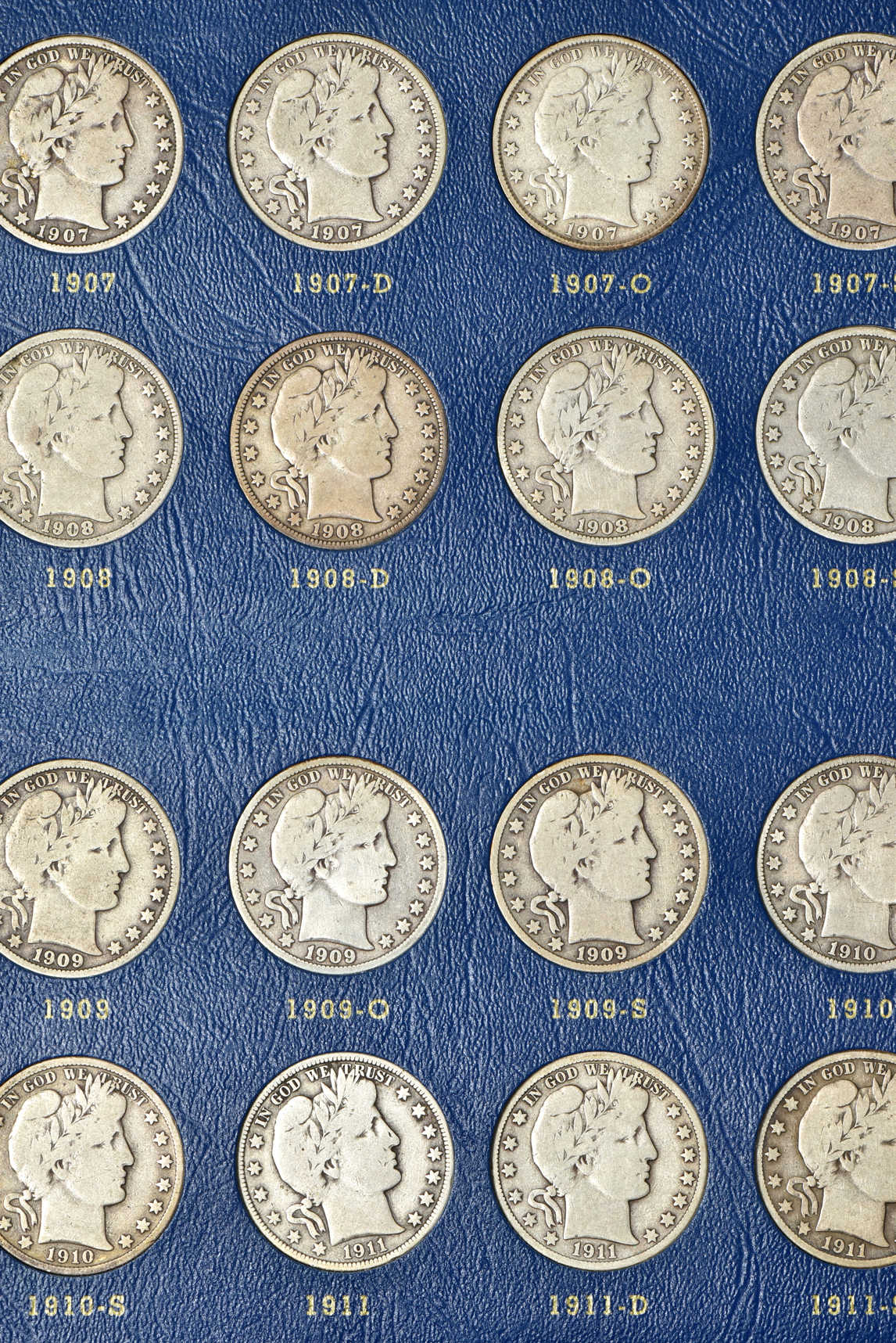 Complete collection of Barber half-dollars in two Whitman albums