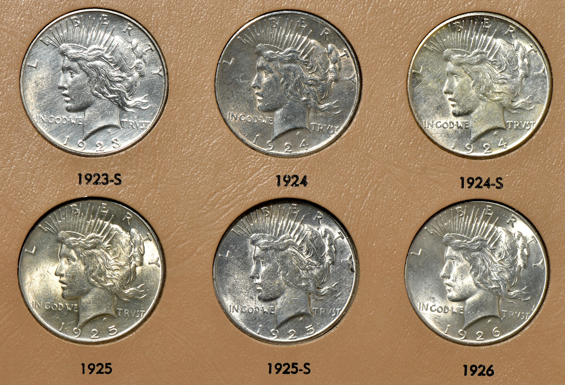 Collection of Peace silver dollars in a complete Dansco 7175 album