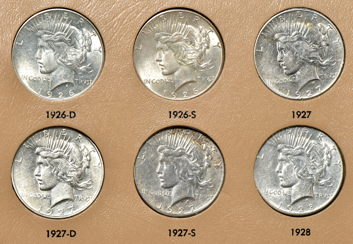 Collection of Peace silver dollars in a complete Dansco 7175 album