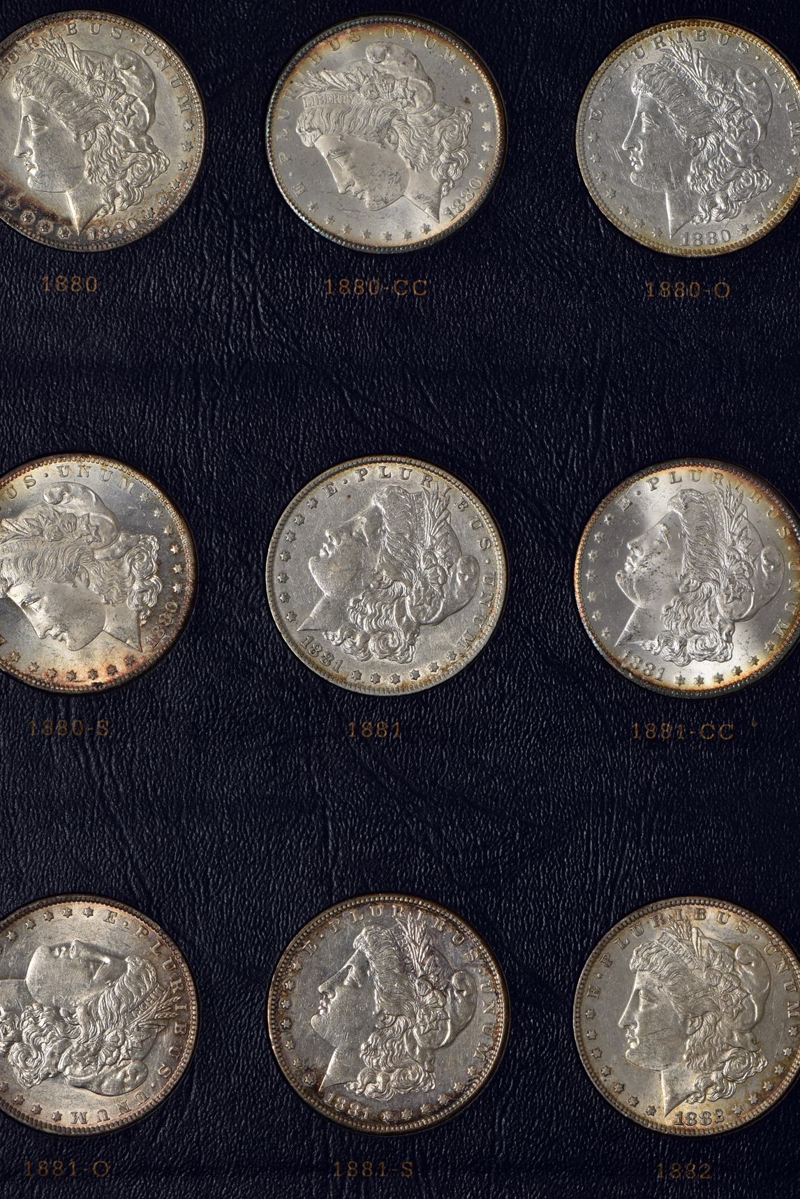 Collection of Morgan silver dollars 1878 through 1891 in a Whitman Classic 9128 album