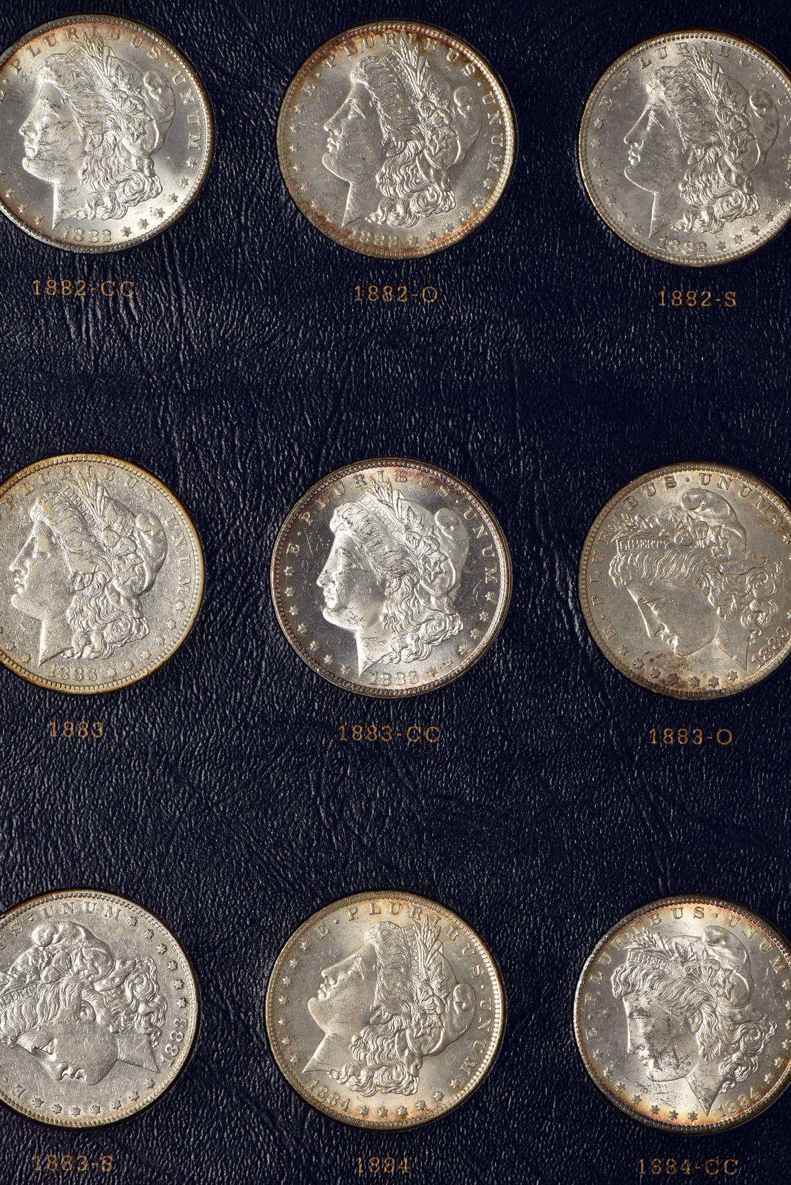Collection of Morgan silver dollars 1878 through 1891 in a Whitman Classic 9128 album