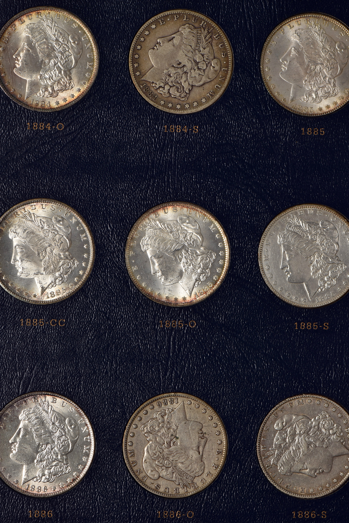 Collection of Morgan silver dollars 1878 through 1891 in a Whitman Classic 9128 album