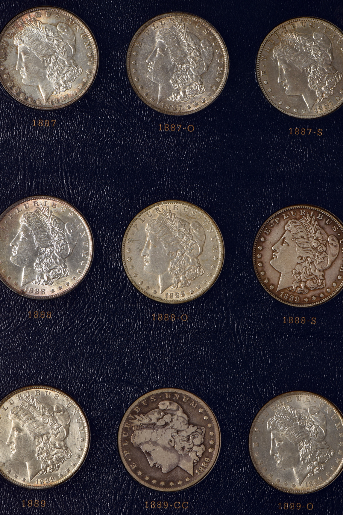 Collection of Morgan silver dollars 1878 through 1891 in a Whitman Classic 9128 album