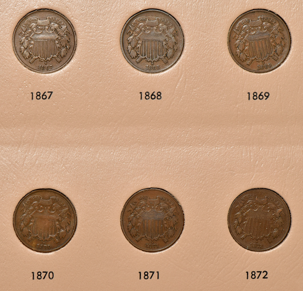 Collections of two-cent pieces and nickel three-cent pieces in a Dansco 6108 album