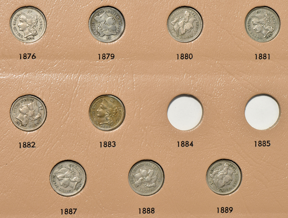 Collections of two-cent pieces and nickel three-cent pieces in a Dansco 6108 album