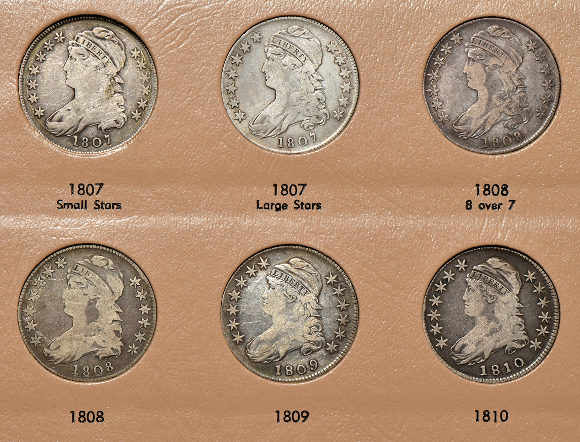 Collection of early half-dollars in a Dansco Volume 1 and Volume 2 6151 album