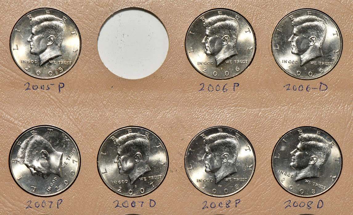 Collection of 94 Kennedy half-dollars, including varieties, in a Dansco album