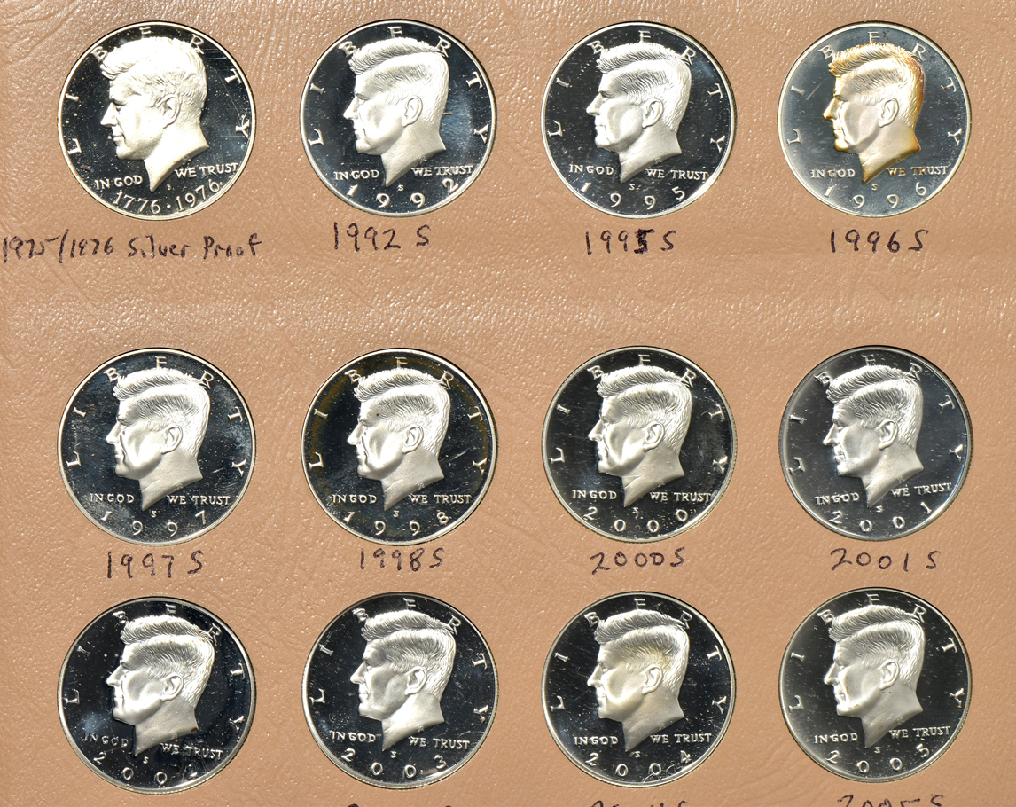 Collection of 94 Kennedy half-dollars, including varieties, in a Dansco album