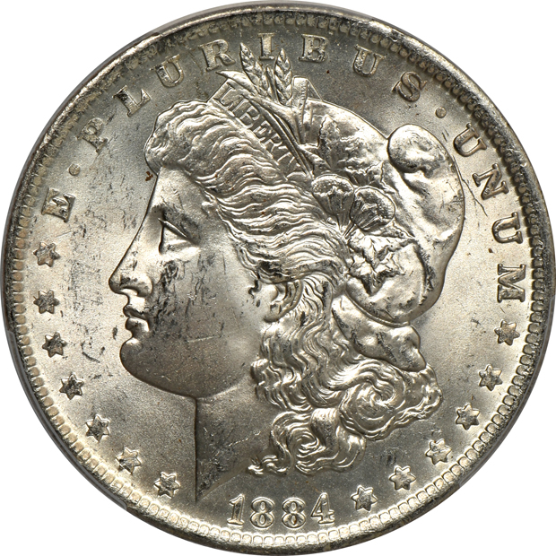 Four Uncirculated Morgan silver dollars certified by PCGS