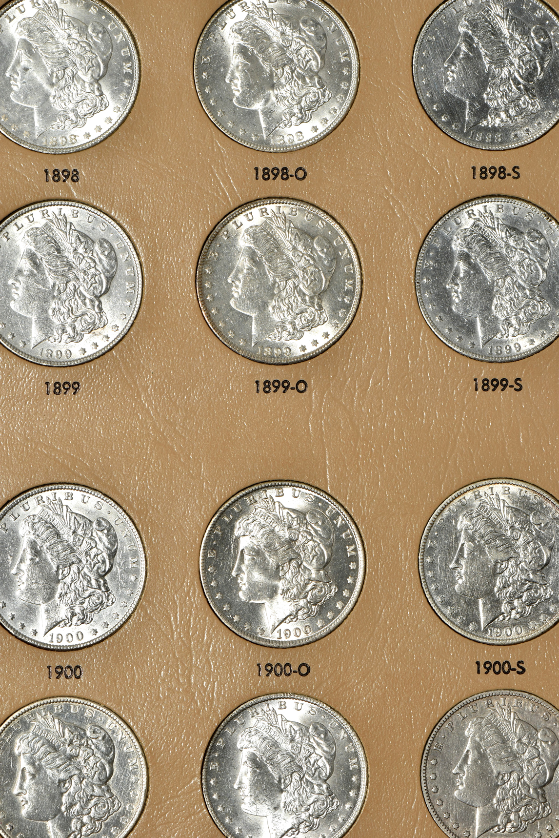 Collection of 45 different Morgan silver dollars in a Dansco 7179 album