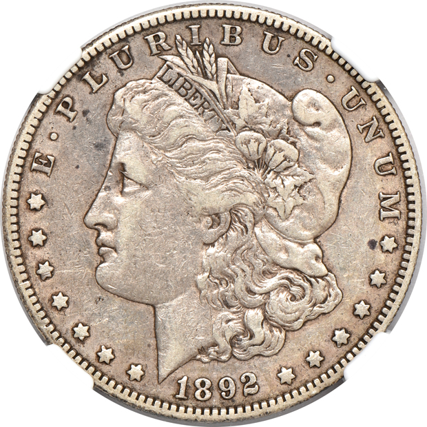 Four circulated Morgan silver dollars certified by NGC