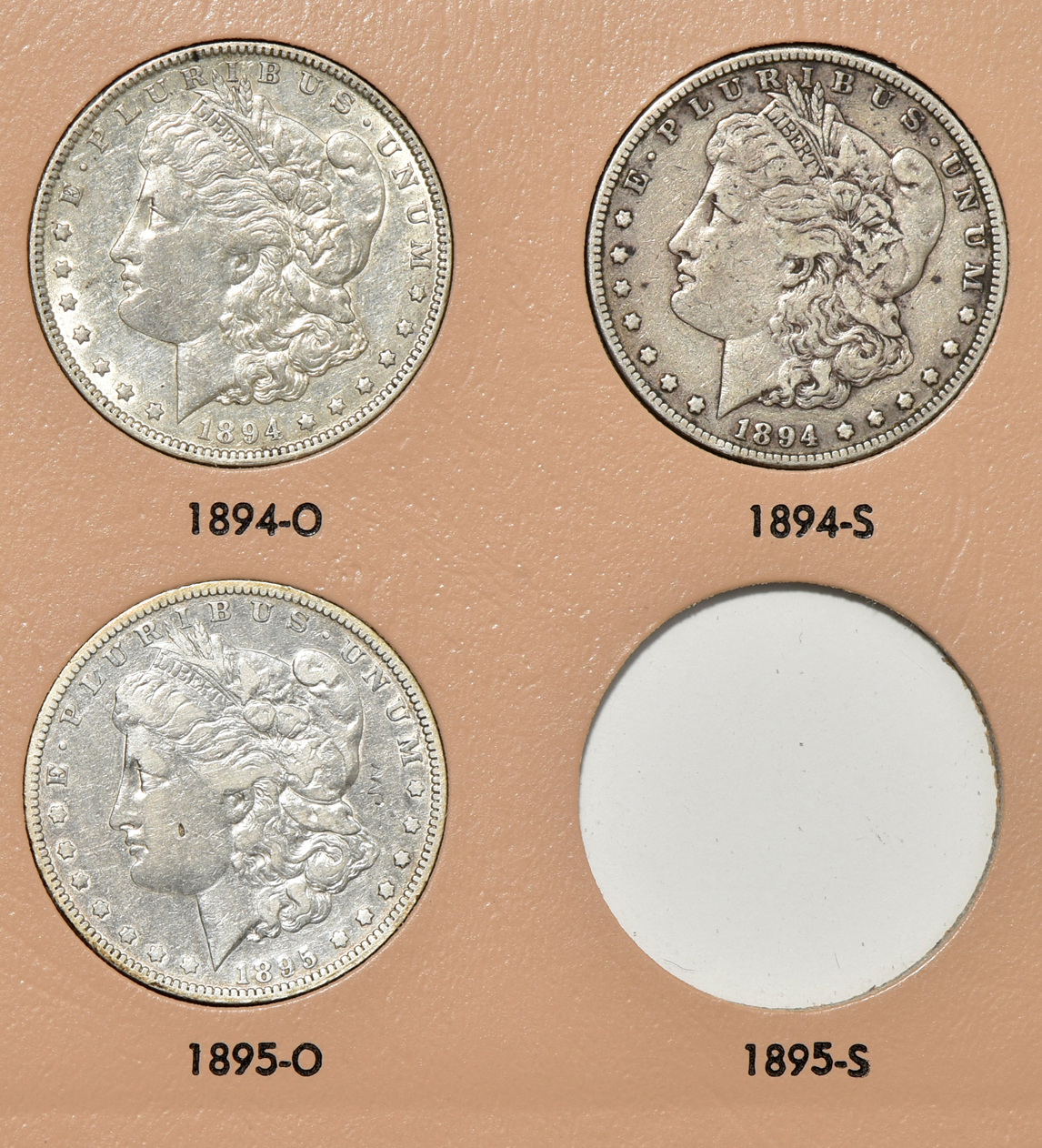 Collection of 39 different Morgan silver dollars in a Dansco 7179 album