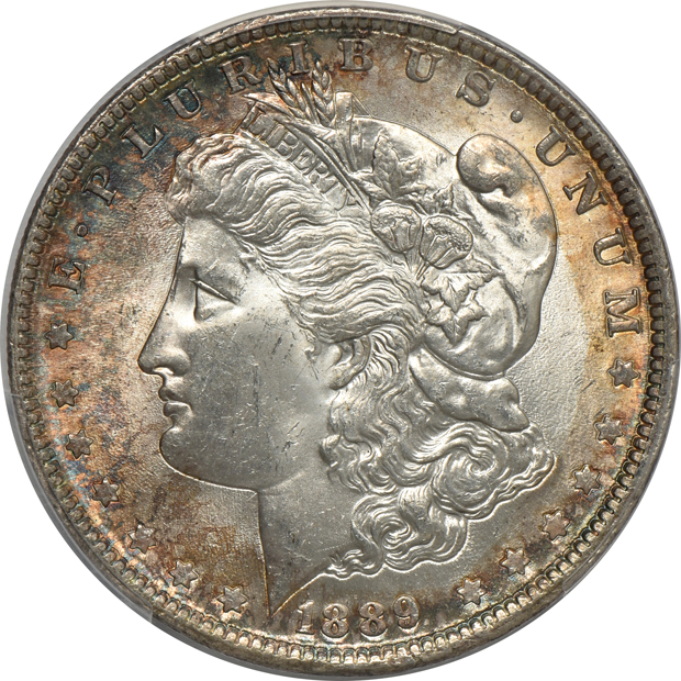 Five toned and certified Uncirculated Morgan silver dollars