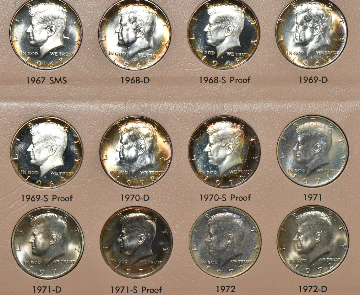 Collections of Kennedy half dollars and Eisenhower dollars in albums
