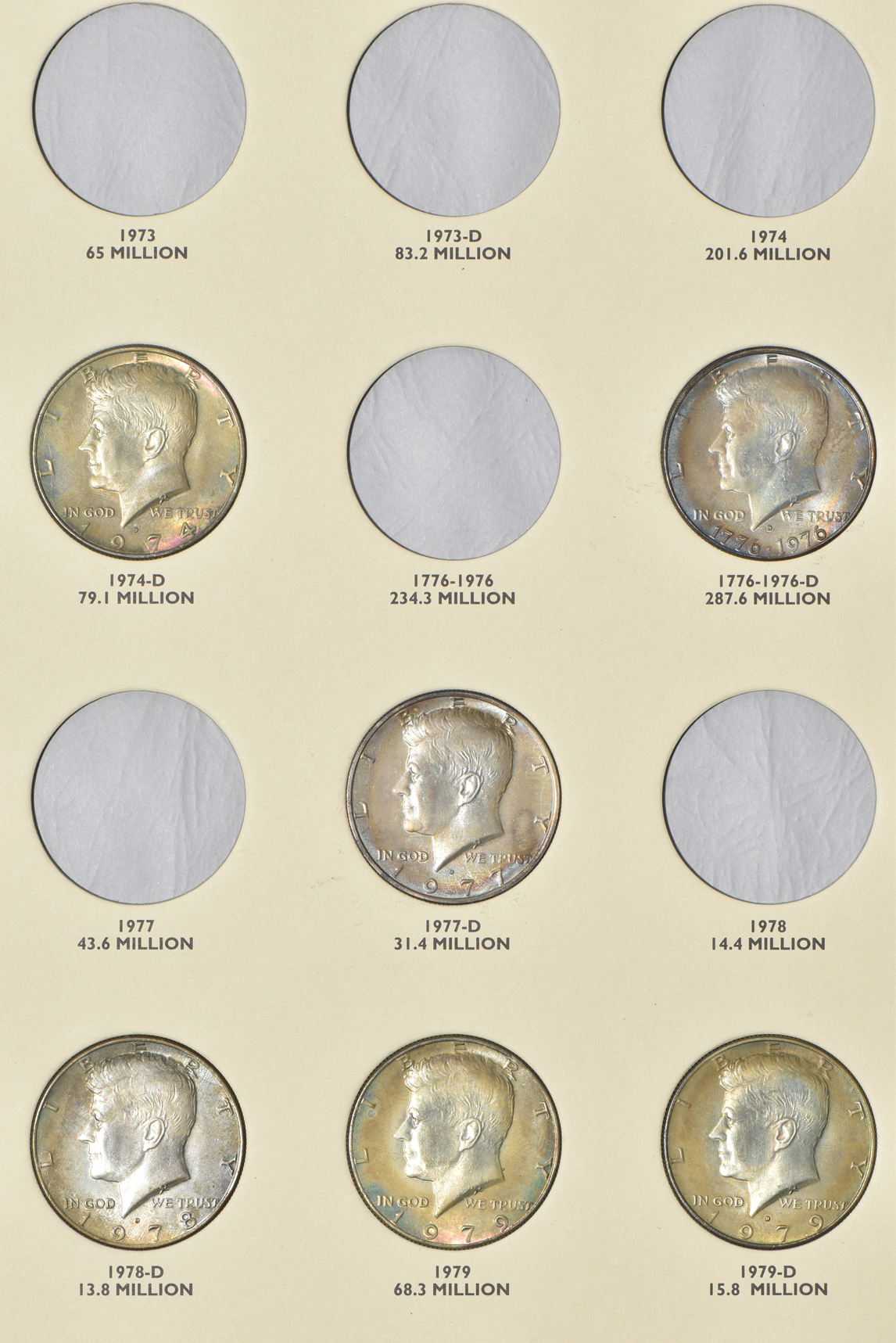 Collections of Kennedy half dollars and Eisenhower dollars in albums