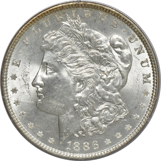 Three Uncirculated Morgan silver dollars, and an Uncirculated Peace silver dollar, all PCGS (rattler) CAC