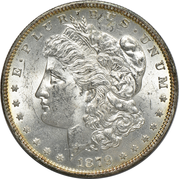 Four Morgan silver dollars, as described