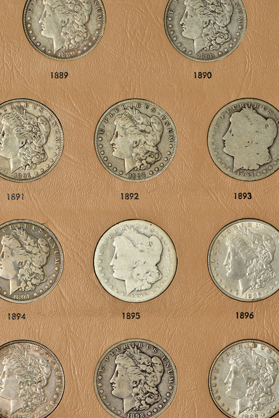 Complete Morgan dollar date set in a Dansco album