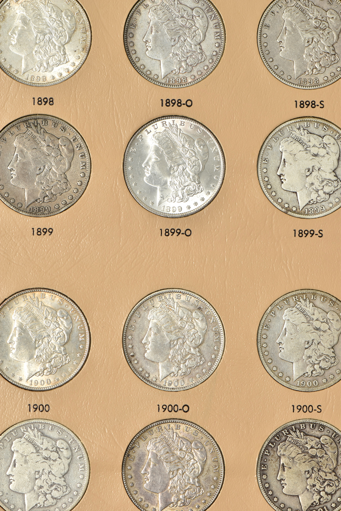 Collection of 47 Morgan silver dollars, 1891 through 1921-S, in a Dansco 7179 album