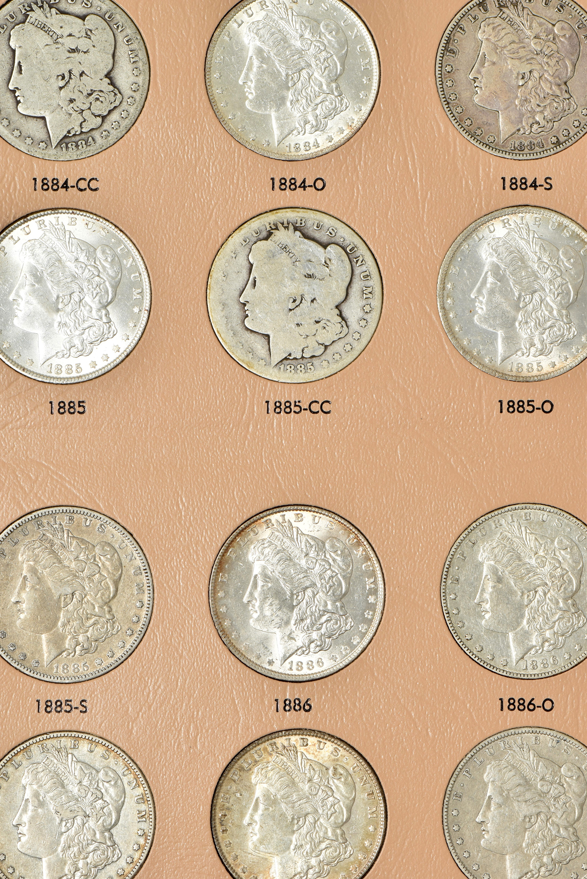 Collection of 48 Morgan silver dollars, 1878 through 1890-S, in a Dansco 7178 album