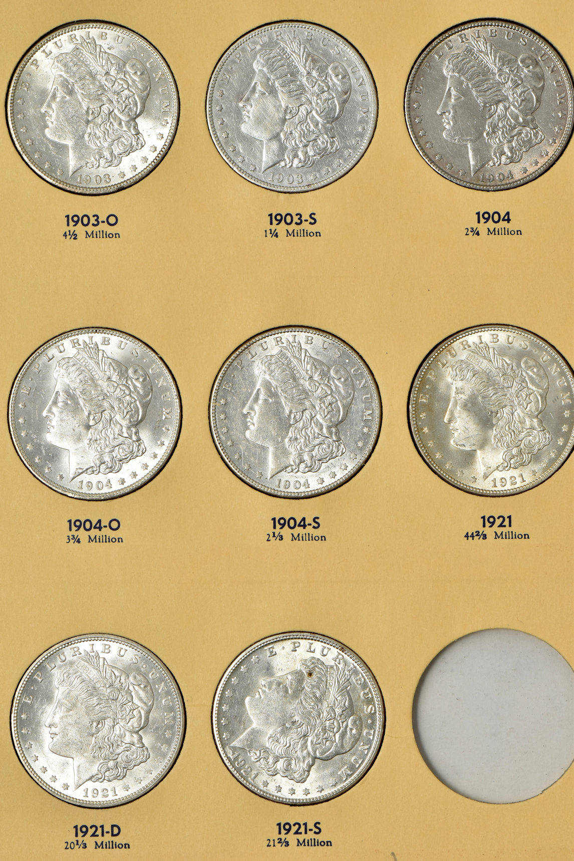 Collection of 26 different Morgan silver dollars, 1897-O through 1921-S, in a Library of Coins Vol. 25 album